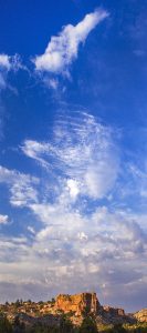 Clouds Mounting High Over Cliffs